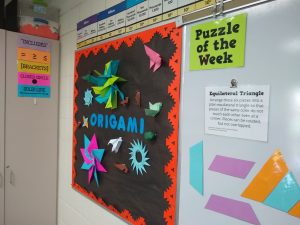 origami bulletin board and puzzle of the week display