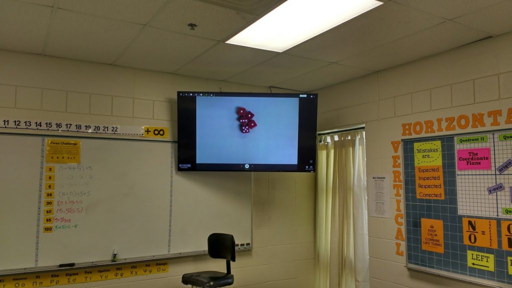 playing petals around the rose with dice under the document camera. 