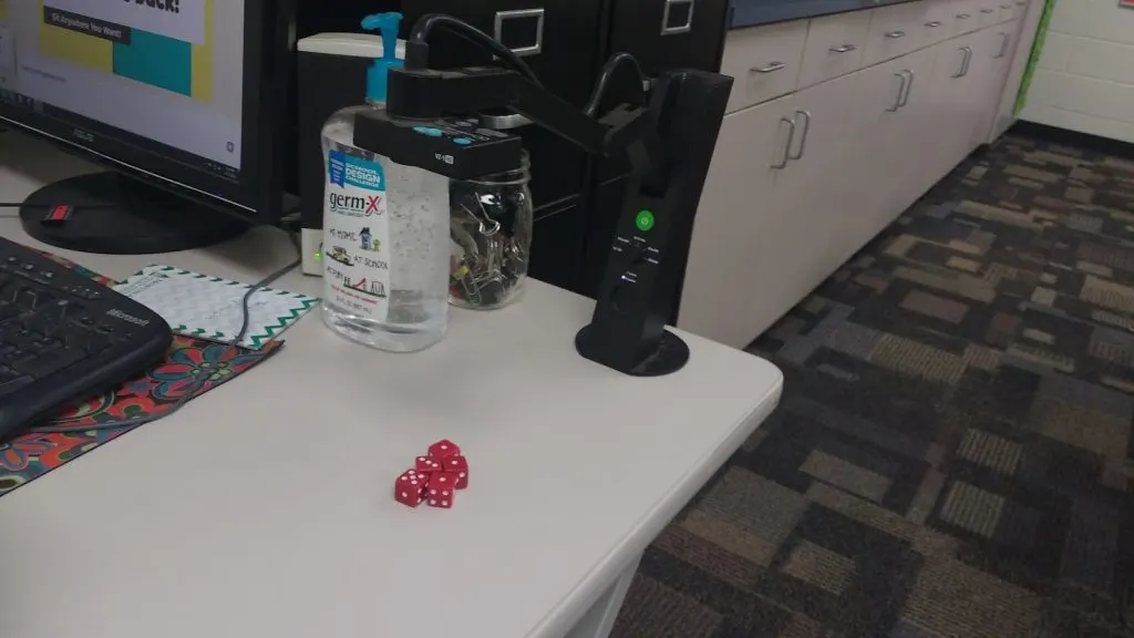 playing petals around the rose with dice under the document camera. 