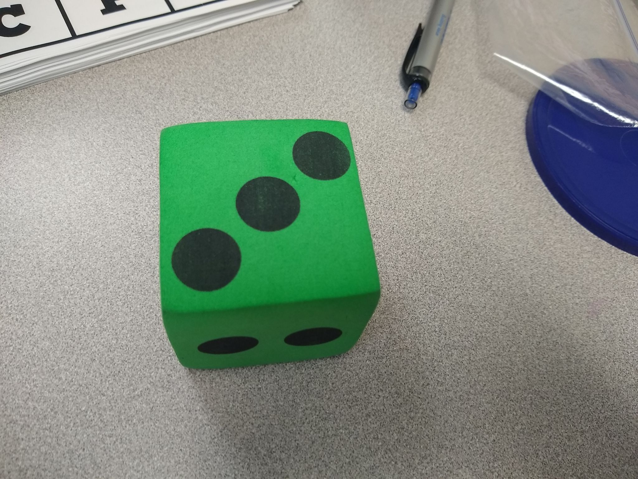 Green Foam Die on Desk.