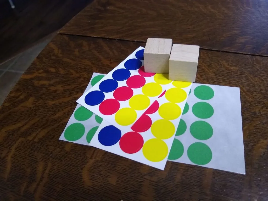 Wooden Dice with Colored Circle Stickers. 