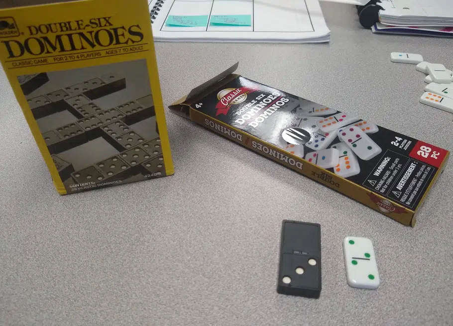 box of standard dominoes compared to Dollar Tree dominoes