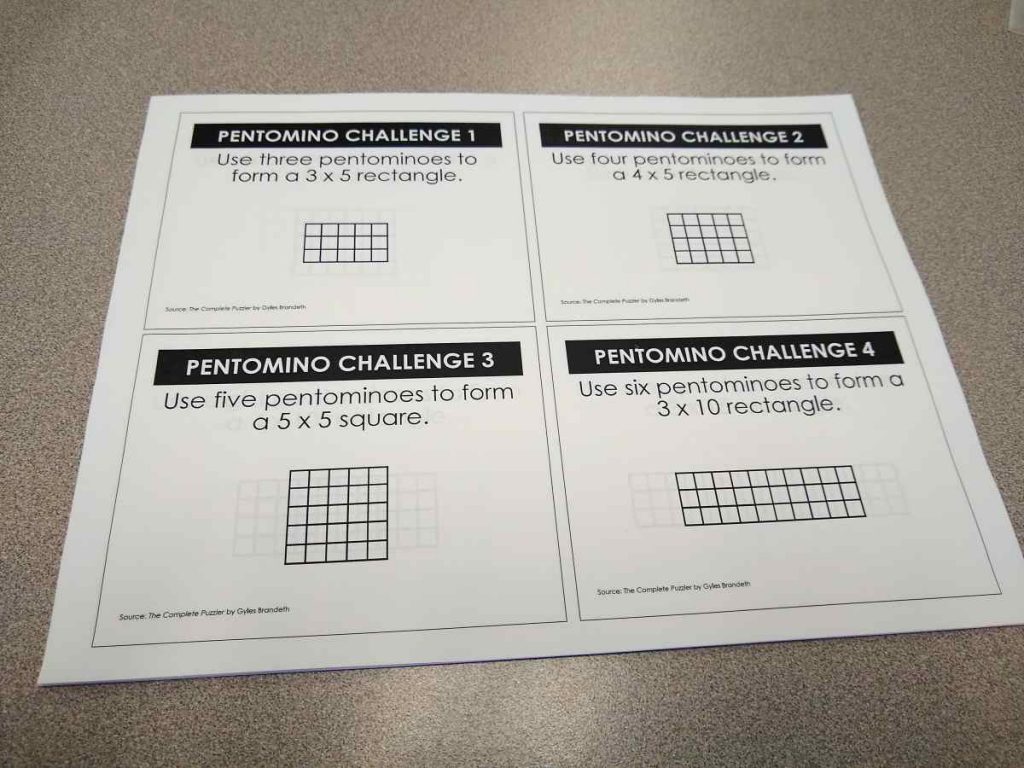 four pentominoes puzzles printed on sheet of letter sized paper 