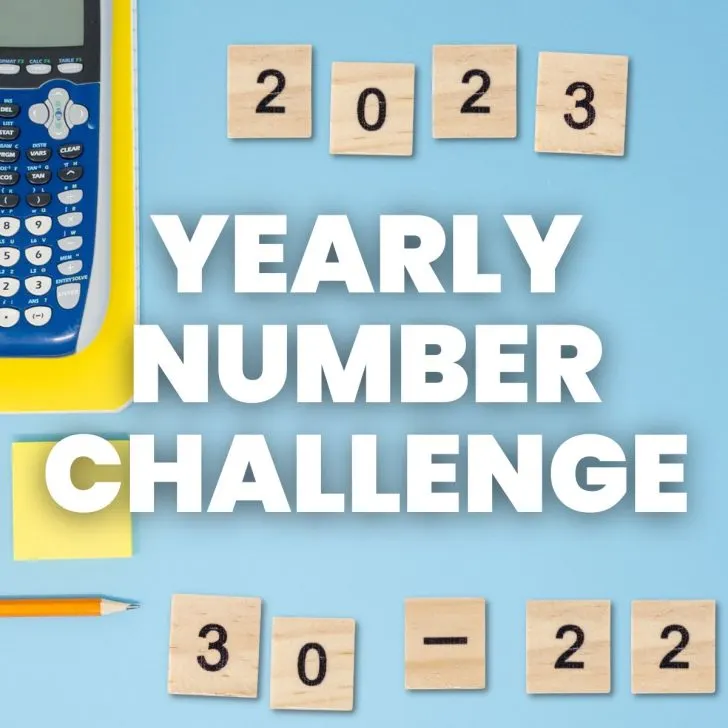 text of "yearly number challenge" with wooden number tiles and a calculator in the background 
