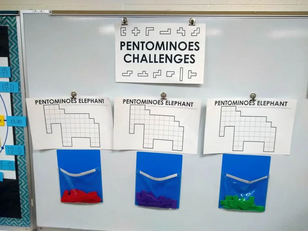 pentominoes challenges hanging on dry erase board 