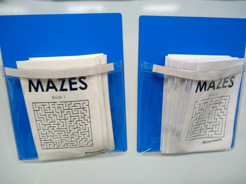 booklets of mazes in magnetic pockets 