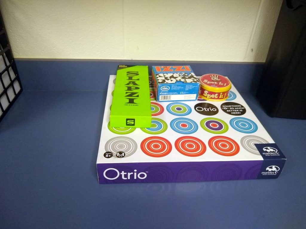 pile of board games in math classroom 