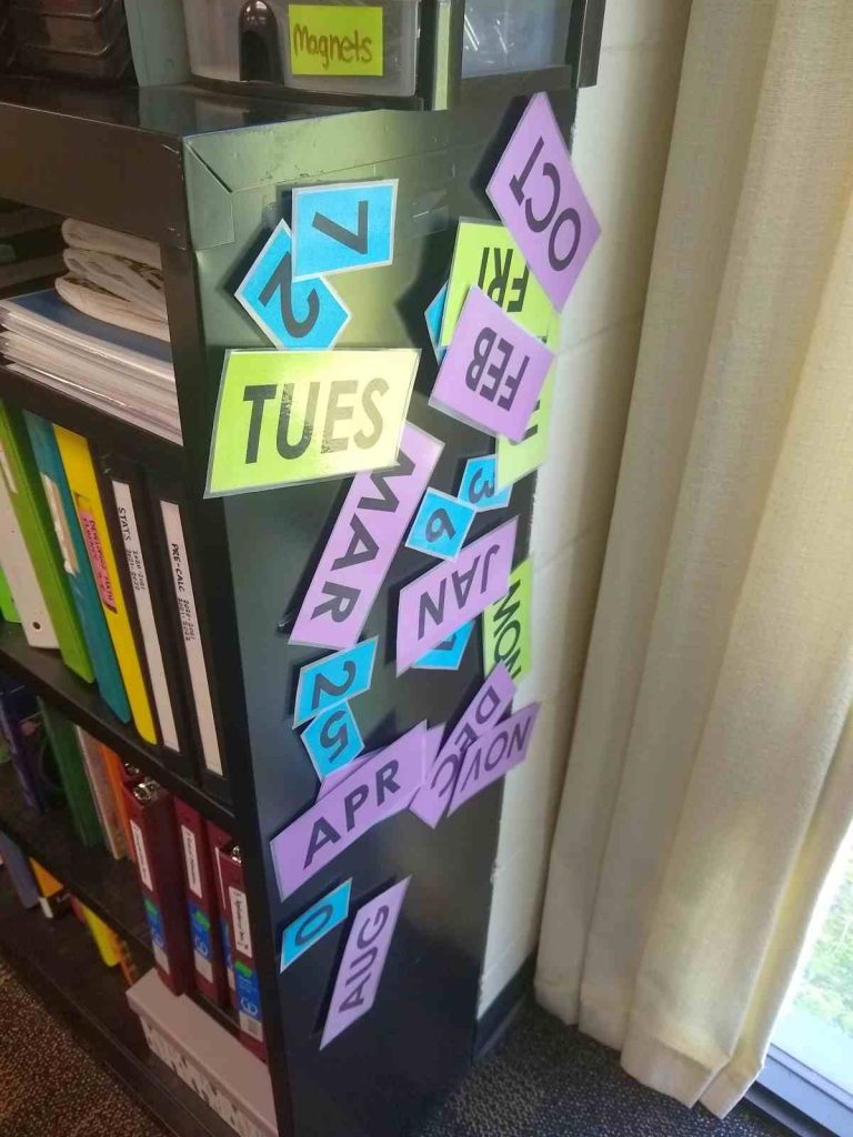 date magnets on side of bookshelf 