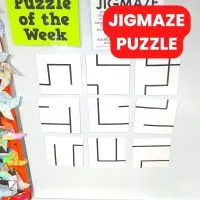 jigmaze puzzle hanging on dry erase board. 