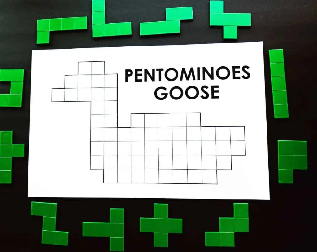 pentominoes goose puzzle surrounded by green pentominoes pieces 