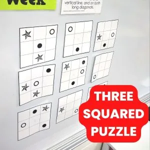 three squared puzzle hanging on dry erase board. 