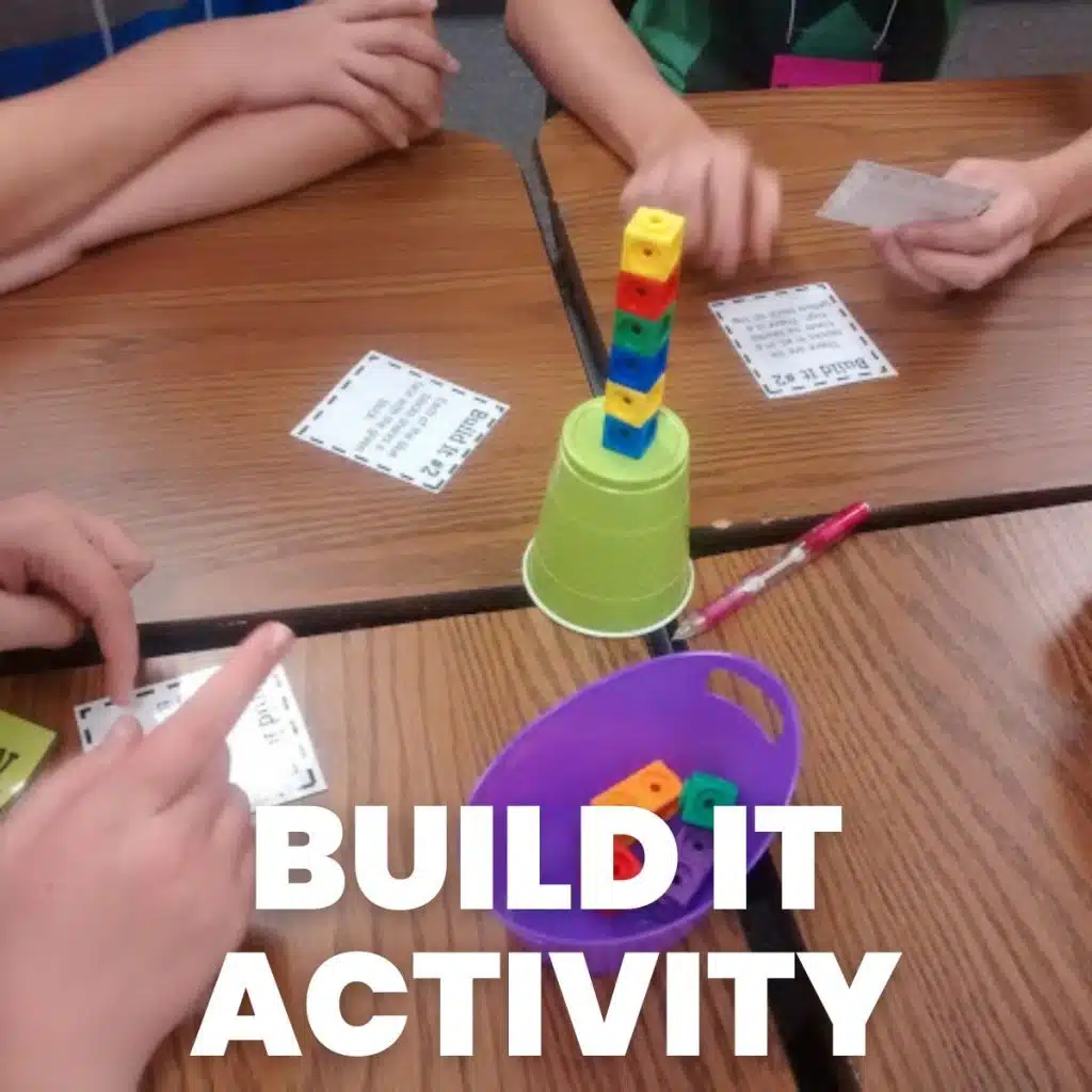 students participating in build it activity with linking or snap cubes in high school math classroom 