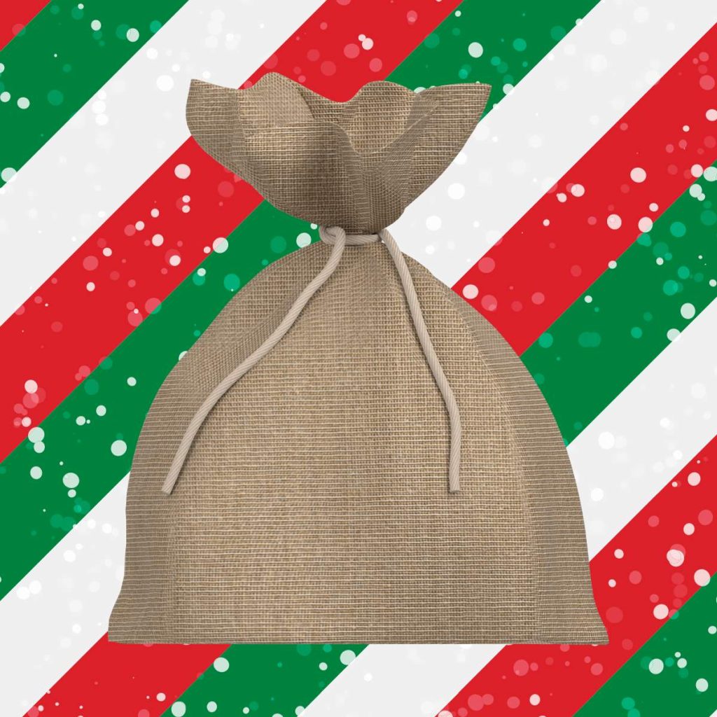 brown burlap gift on christmas stripe background 