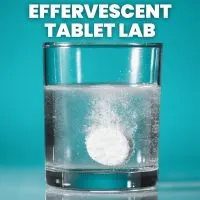 effervescent tablet fizzing in glass of water with text 