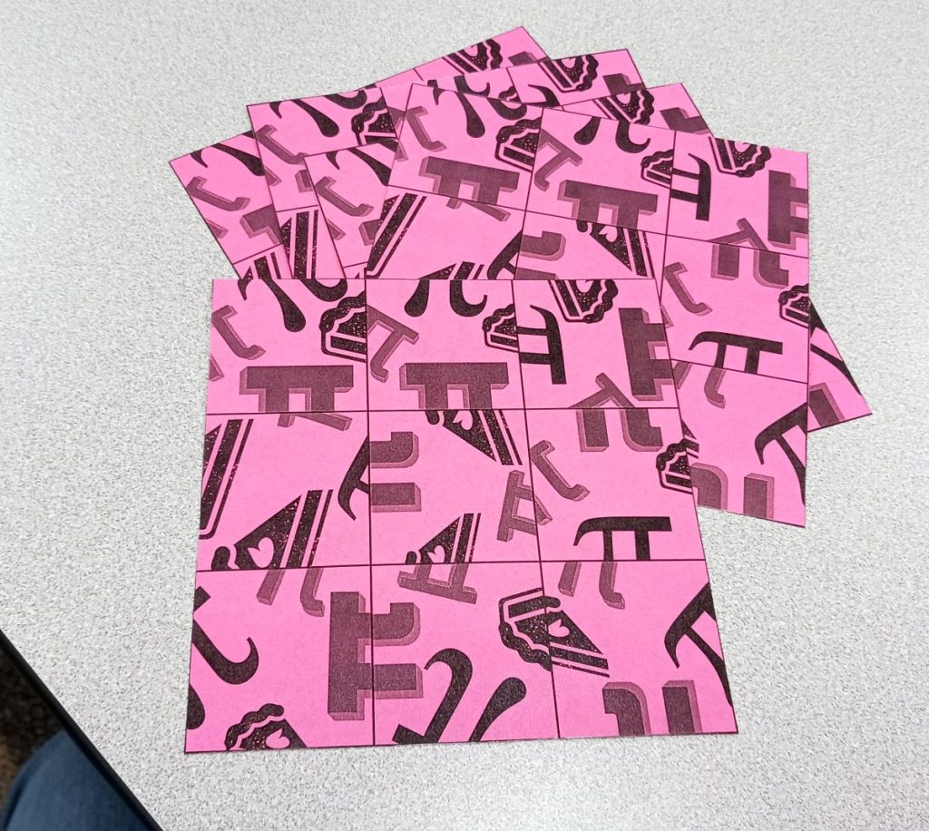 pi puzzle for pi day printed on pink paper and cut out 