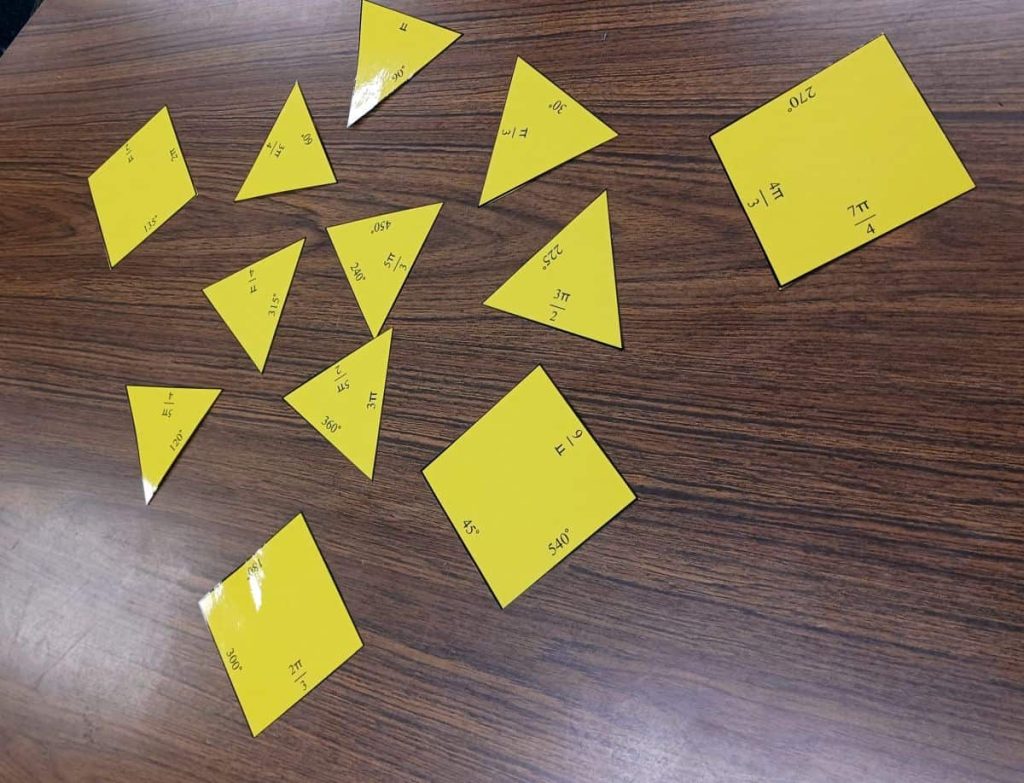 converting degrees and radians tarsia puzzle pieces laid out on table 