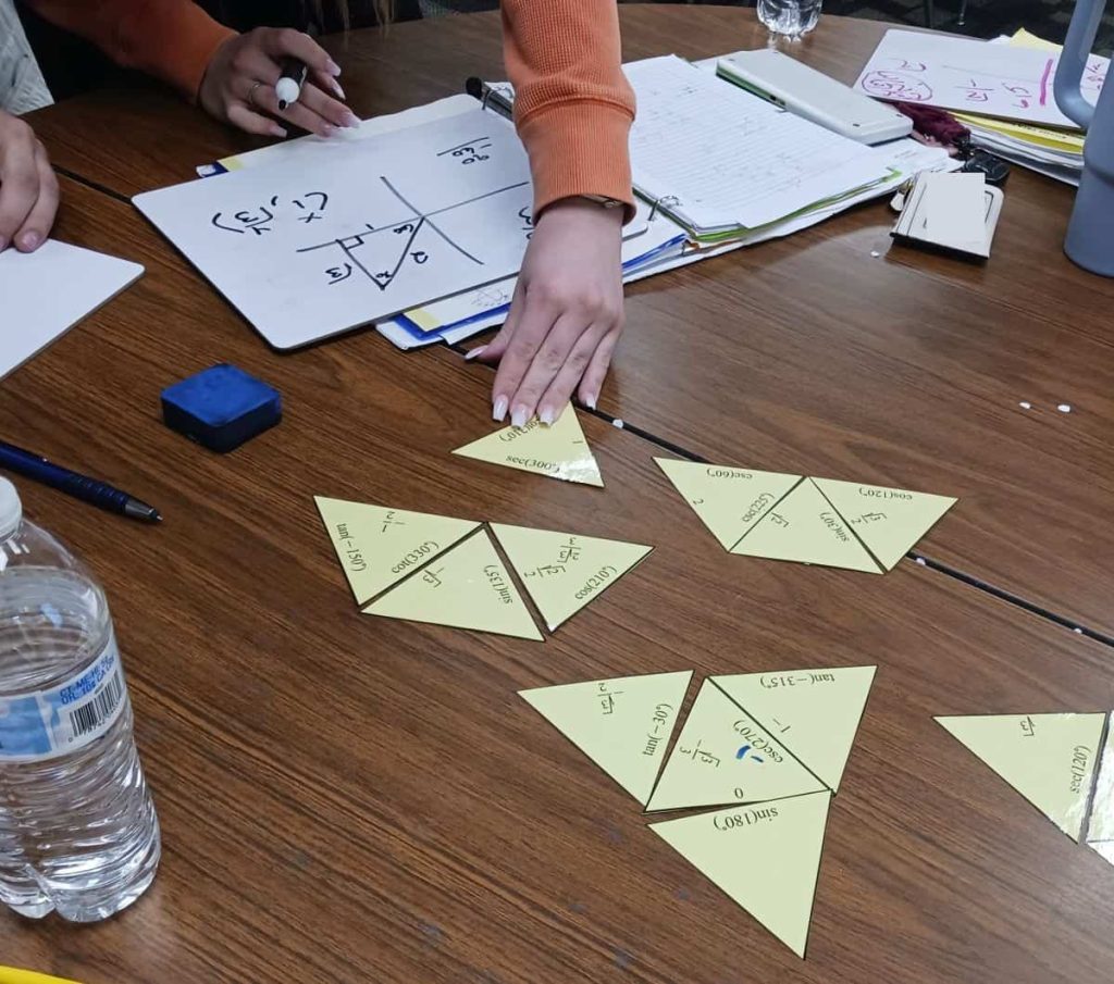 student moving piece while solving evaluating trig functions tarsia puzzle 