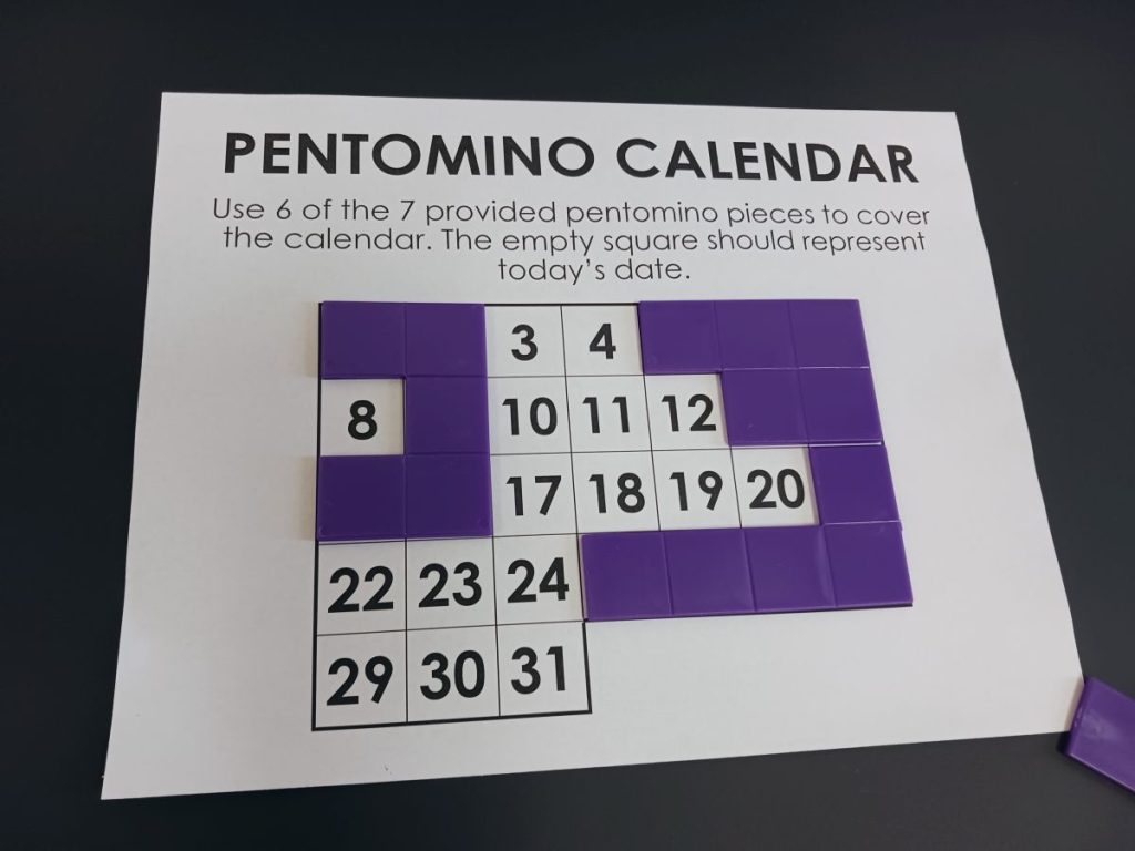 partially solved pentomino calendar puzzle 