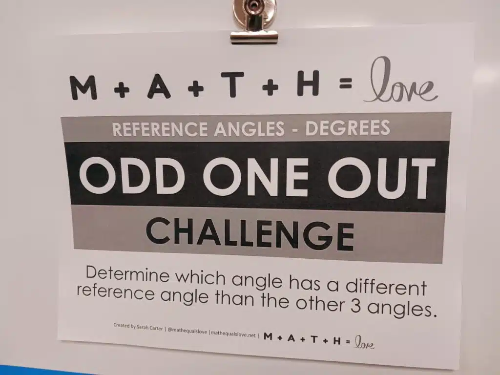 instructions for trig reference angles activity hanging on dry erase board in math classroom 