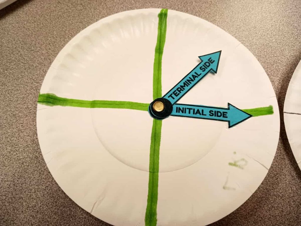close-up of paper plate angle spinner in trigonometry classroom 