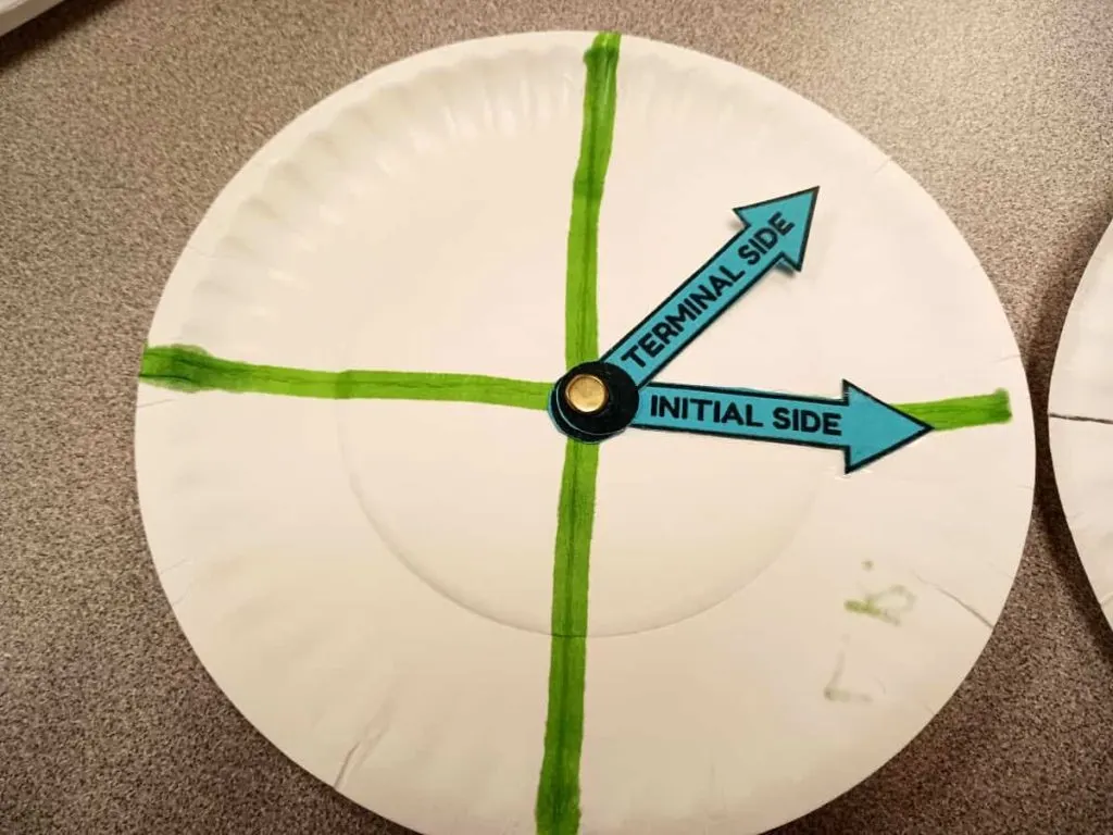 close-up of paper plate angle spinner in trigonometry classroom 