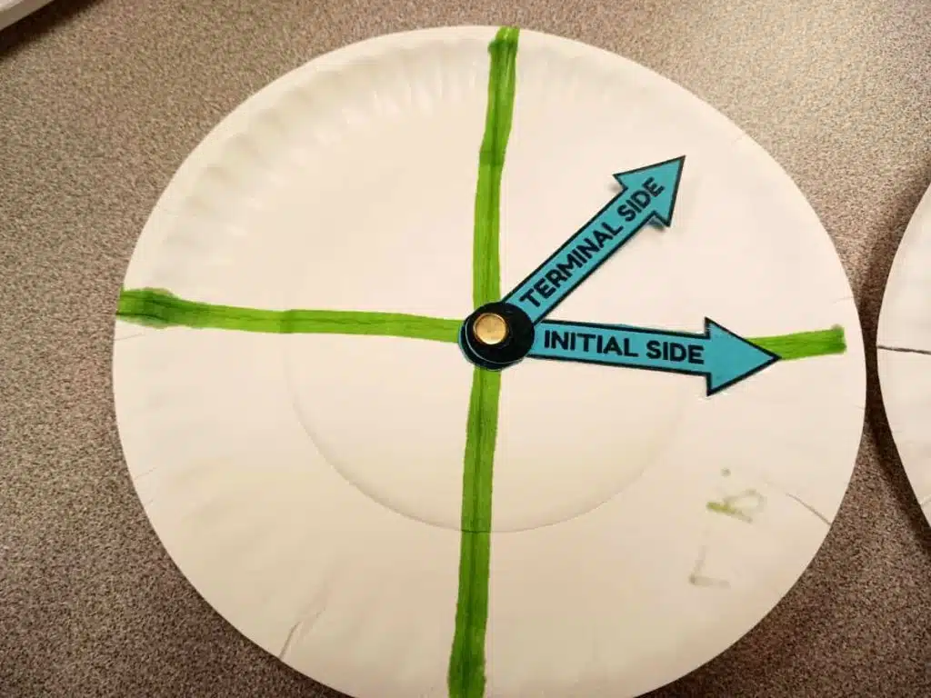 close-up of paper plate angle spinner in trigonometry classroom 