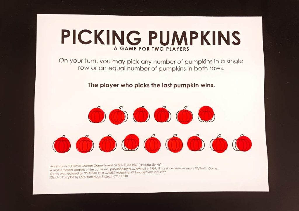 picking pumpkins game with red bingo chips on top of each pumpkin 