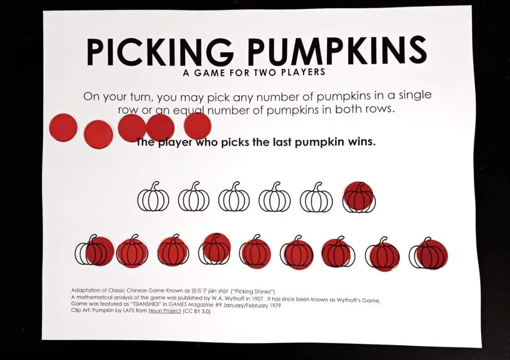 picking pumpkins game board with five bingo chips removed from top row 