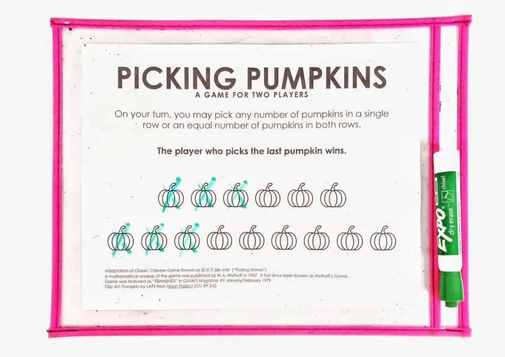 picking pumpkins game board in dry erase pocket with three pumpkins picked from each row 