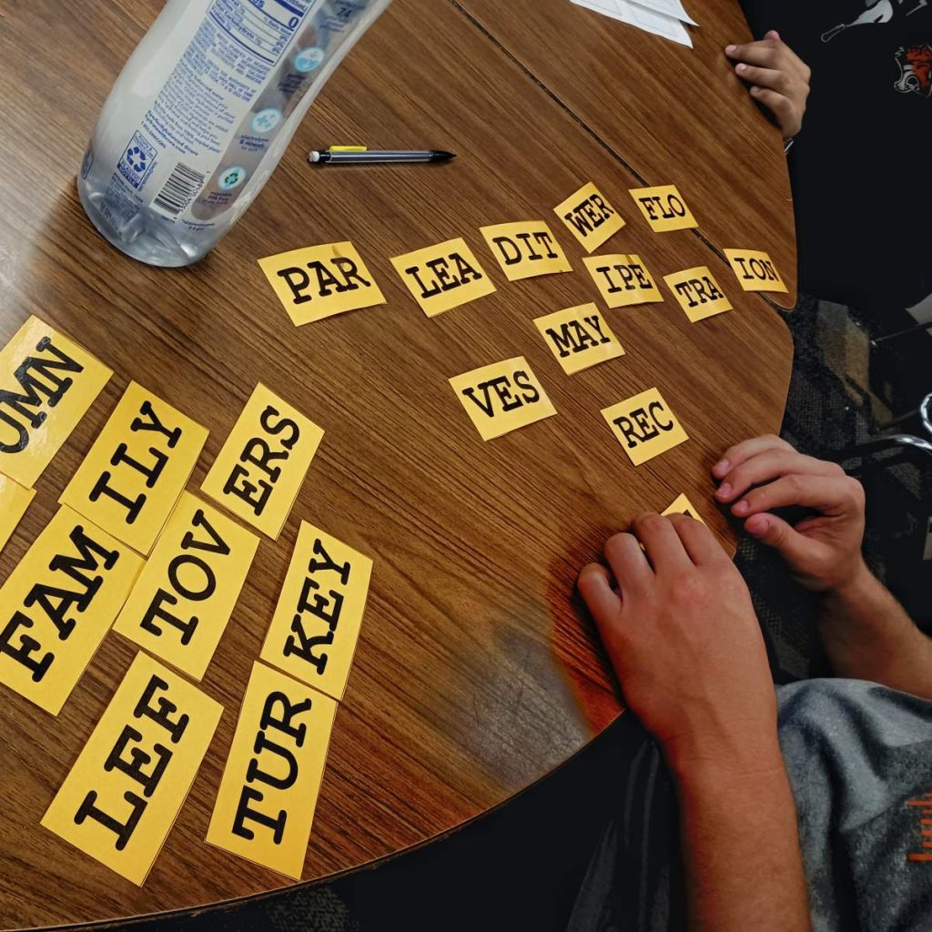 students working on thanksgiving triples word puzzle 