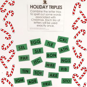 holiday triples word puzzle hanging on dry erase board in math classroom. 
