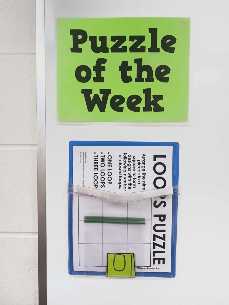 puzzle of the week poster with loops puzzle in magnetic pocket. 