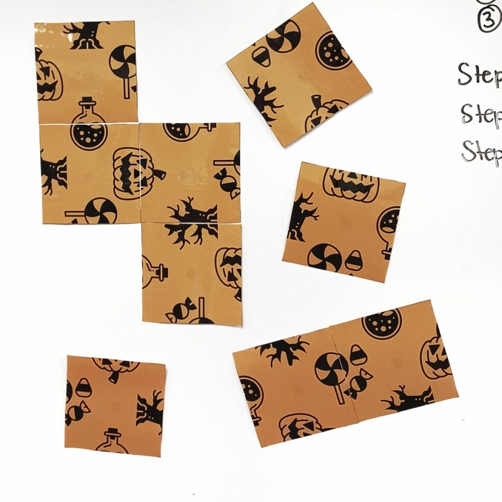 large version of halloween edge matching puzzle on dry erase board. 