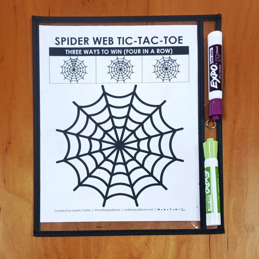 spider web tic tac toe game for halloween in dry erase pocket. 