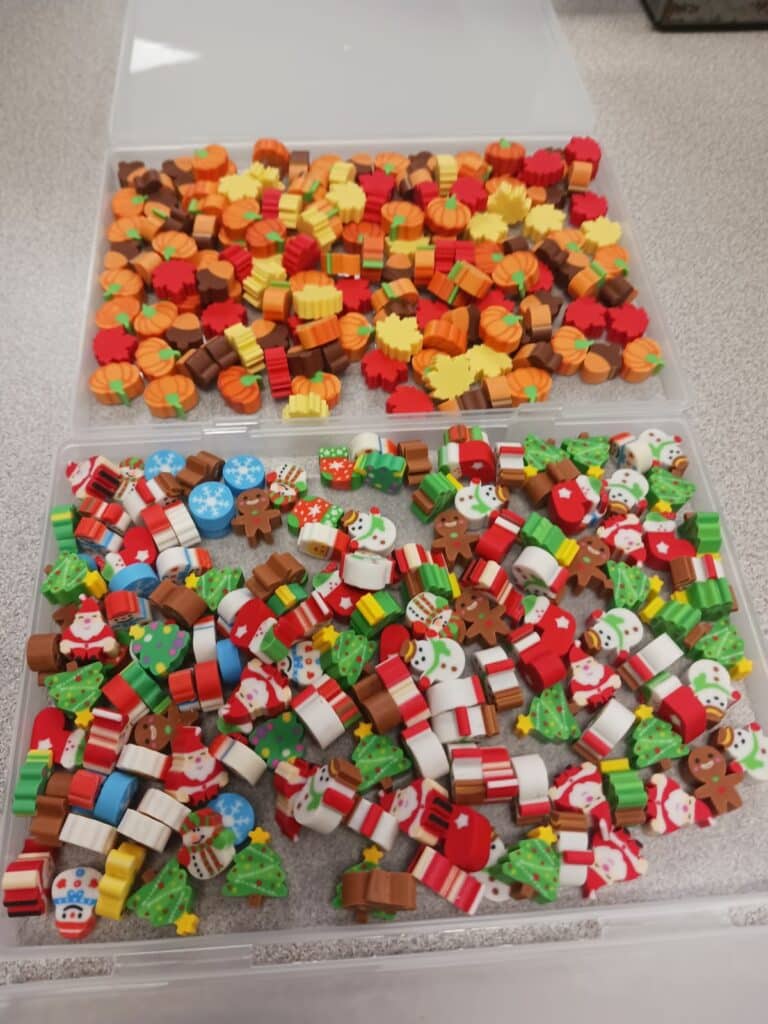 fall and christmas mini erasers in plastic containers. 