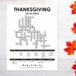 Thanksgiving Fill-In Word puzzle next to fall leaves.