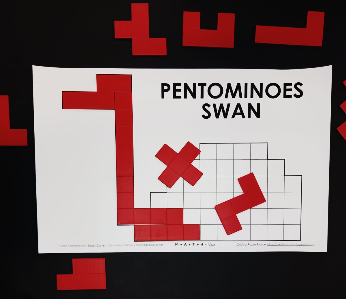 partially solved pentomino swan puzzle.