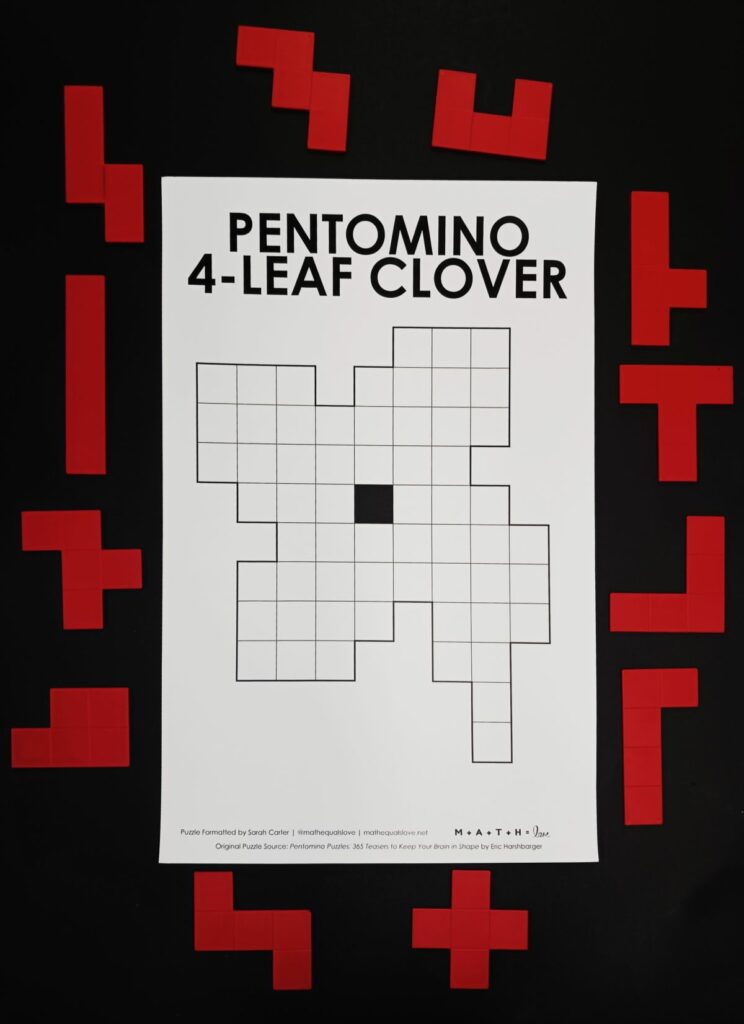 pentominoes 4-leaf clover puzzle for st patricks day with pentominoes surrounding the edge of the paper. 