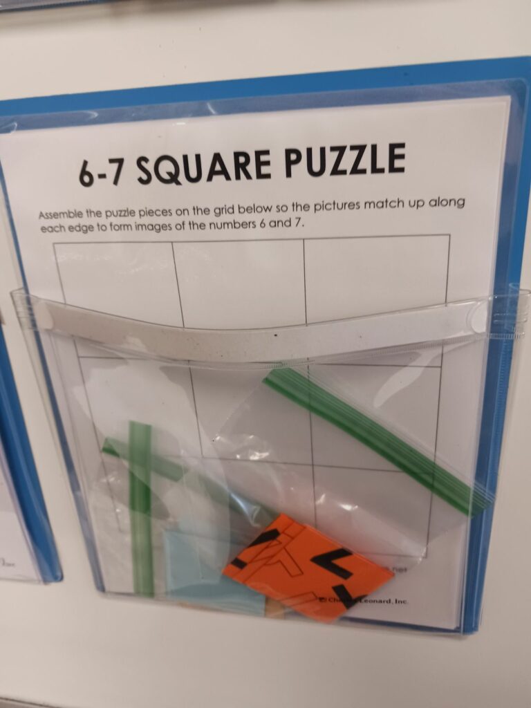6-7 square edge matching puzzle in magnetic pocket. 