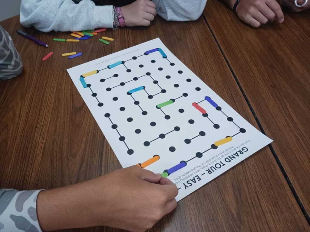 students working on jumbo grand tour logic puzzle.