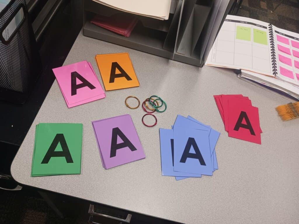 cut letter hold up cards waiting for punching.